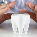 close up man holding hands table